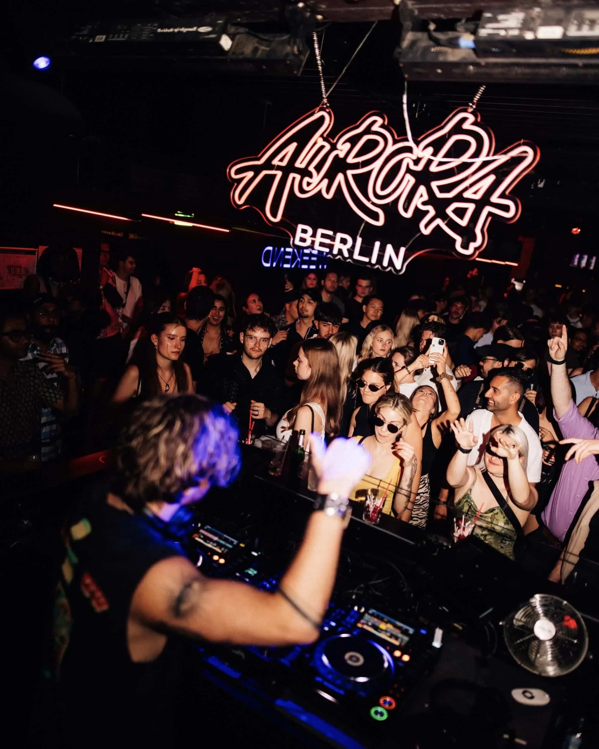 Denno Matini behind the decks at Aurora, Berlin